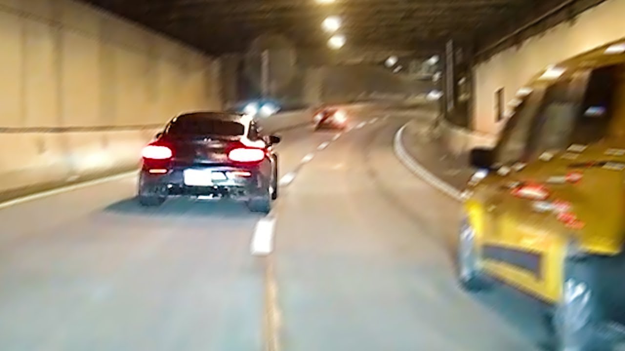 black benz speeds past me