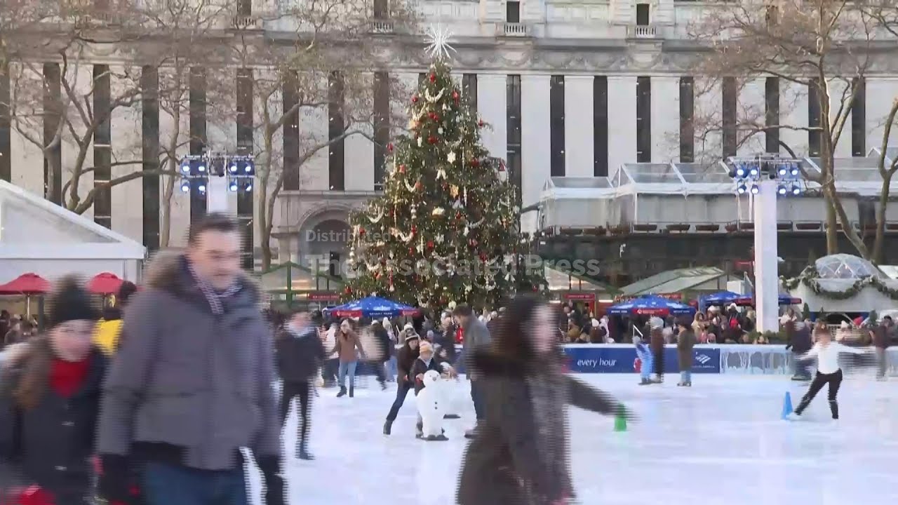 Hundreds visit New York's Bryant Park to ice skate on Christmas Eve