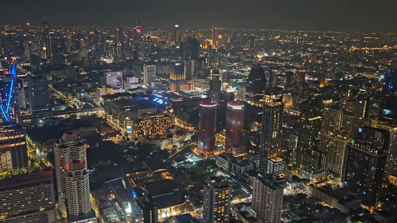 Bangkok at night from the 83rd floor of Baiyoke Sky Hotel .