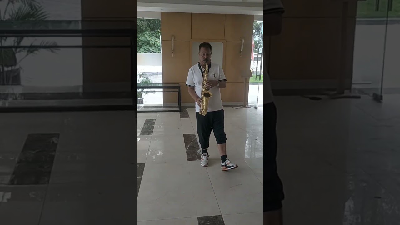 Amul Karki Dai is getting ready to play his saxophone in Chitwan! 🎷🎶... #music #guitarcover #sax