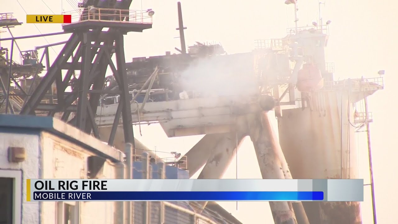 Fire on decommissioned oil rig on east side of Mobile River