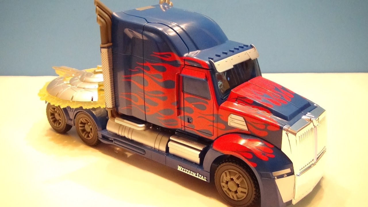 TRANSFORMERS 4 AGE OF EXTINCTION OPTIMUS PRIME FIRST EDITION VIDEO TOY REVIEW