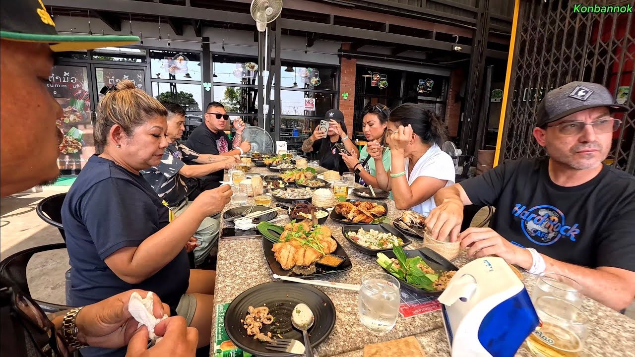 Eat lunch at the restaurant by Mekong river with American friends in Vientiane, Laos