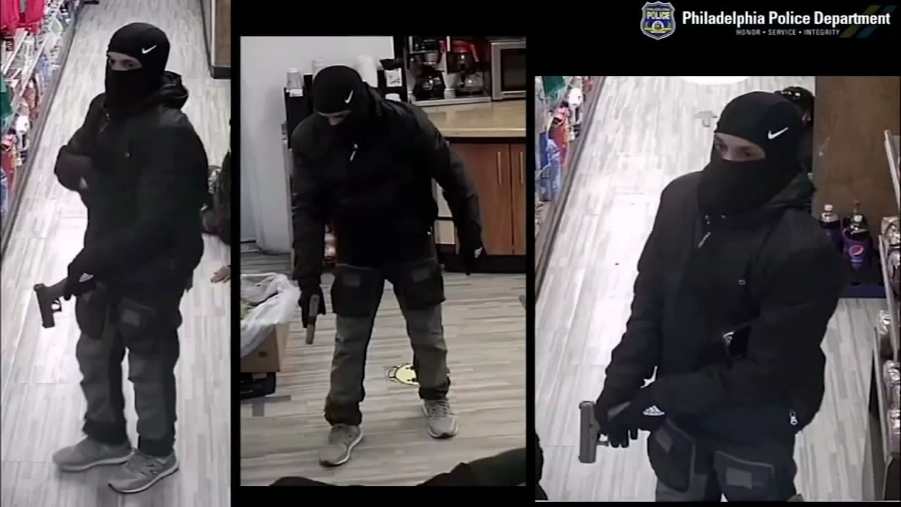 'We're getting robbed': Masked armed robbers hold up grocery store