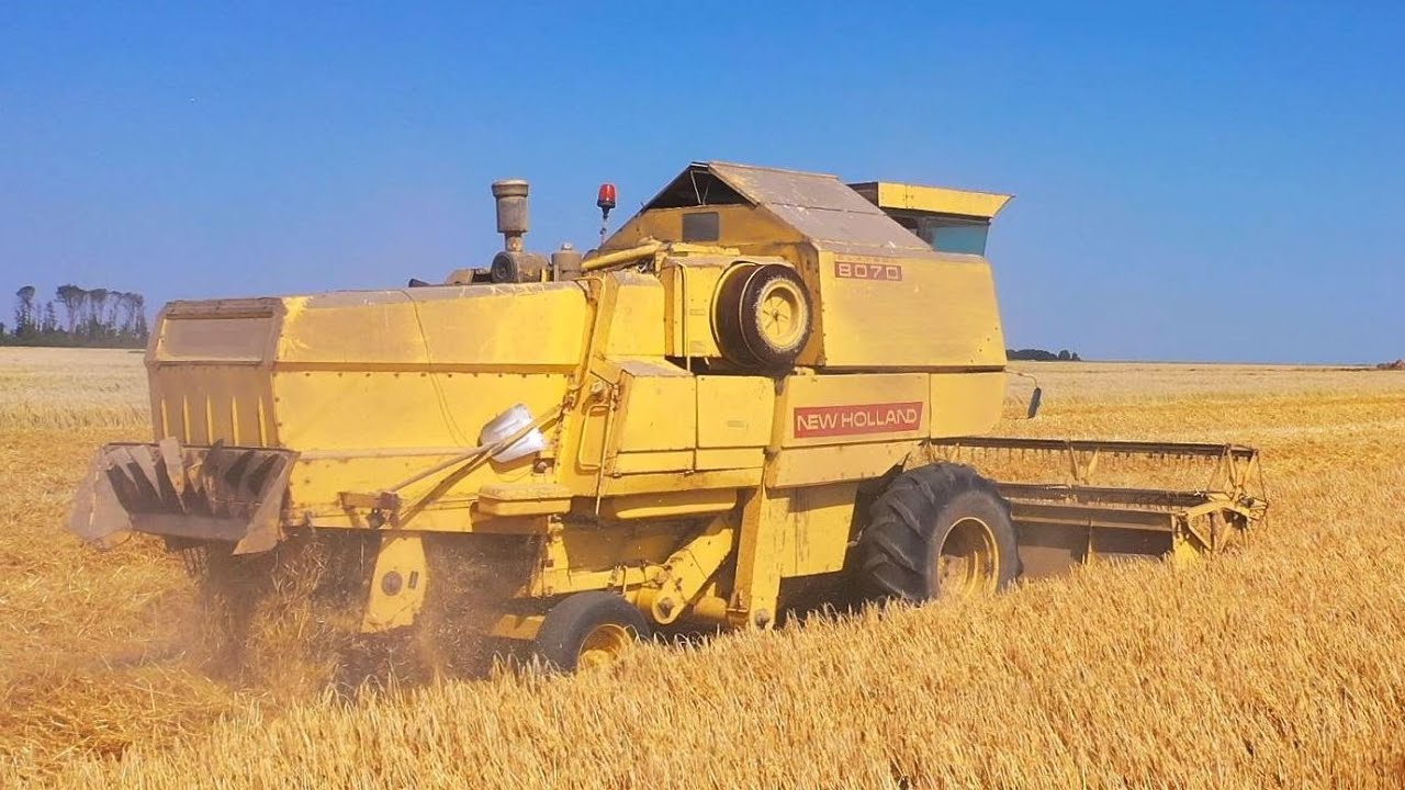 Combinen en persen in de wintergerst met New Holland. Mts.W. Pool Woldendorp.