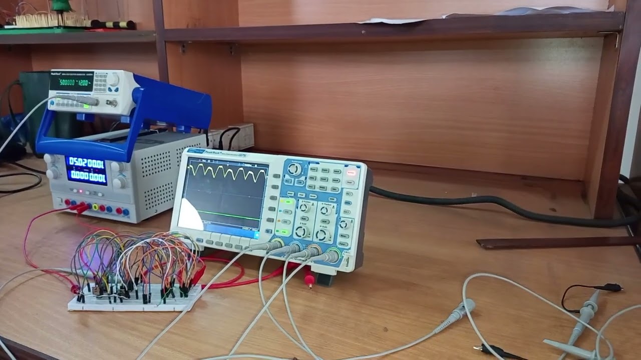 Full wave rectification by using mosfets through op-amp 