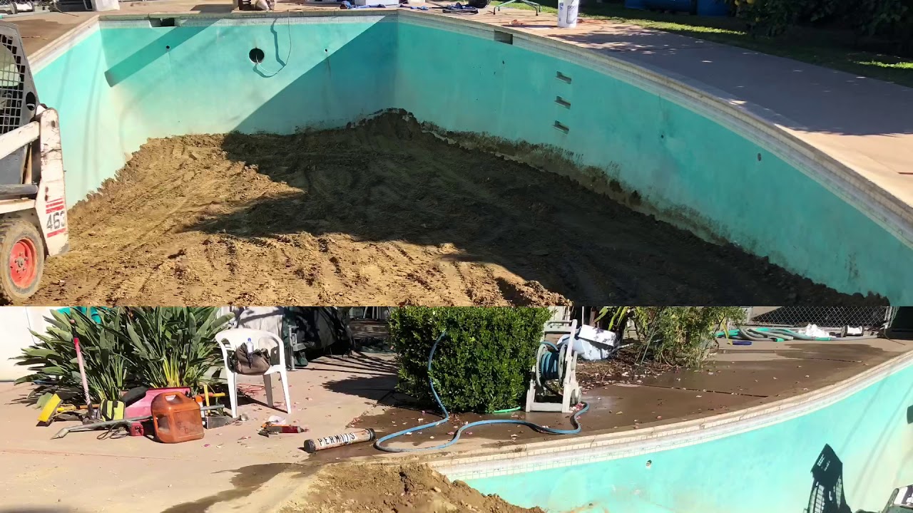 Filling in a swimming pool with a mini bobcat