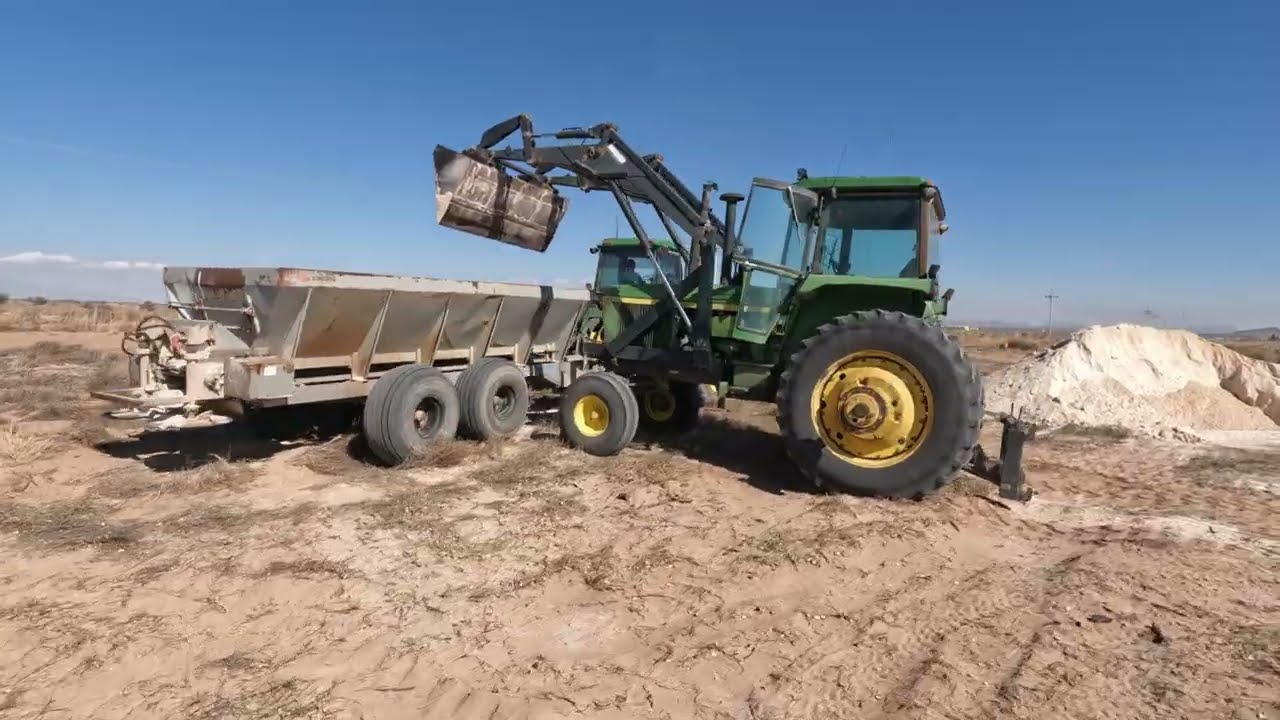spreading gypsum on pivot field (with the john deere 4960 and stoltzfus spreader)
