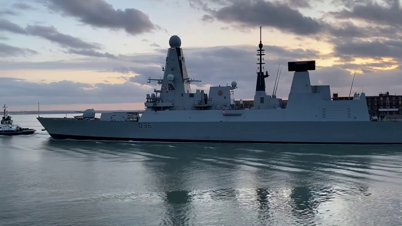 HMS Defender - dusk departure from Portsmouth