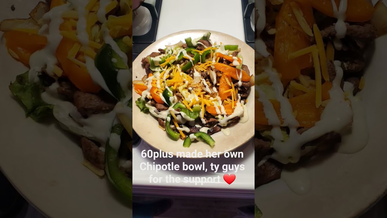 homemade Chipotle bowl with mixed salad, cheese, ganzulas rice, sweet peppers steak / avocado ranch
