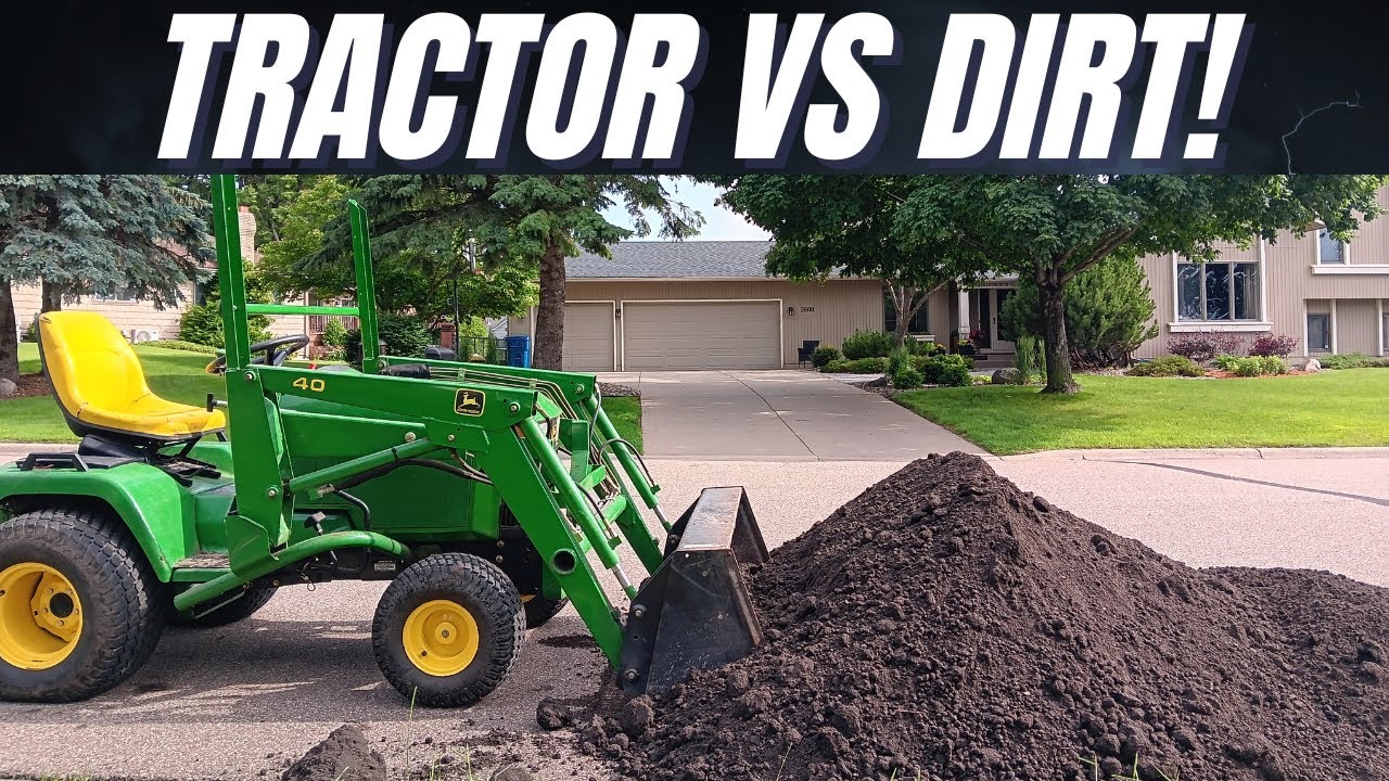 John Deere 445 vs a pile of dirt!