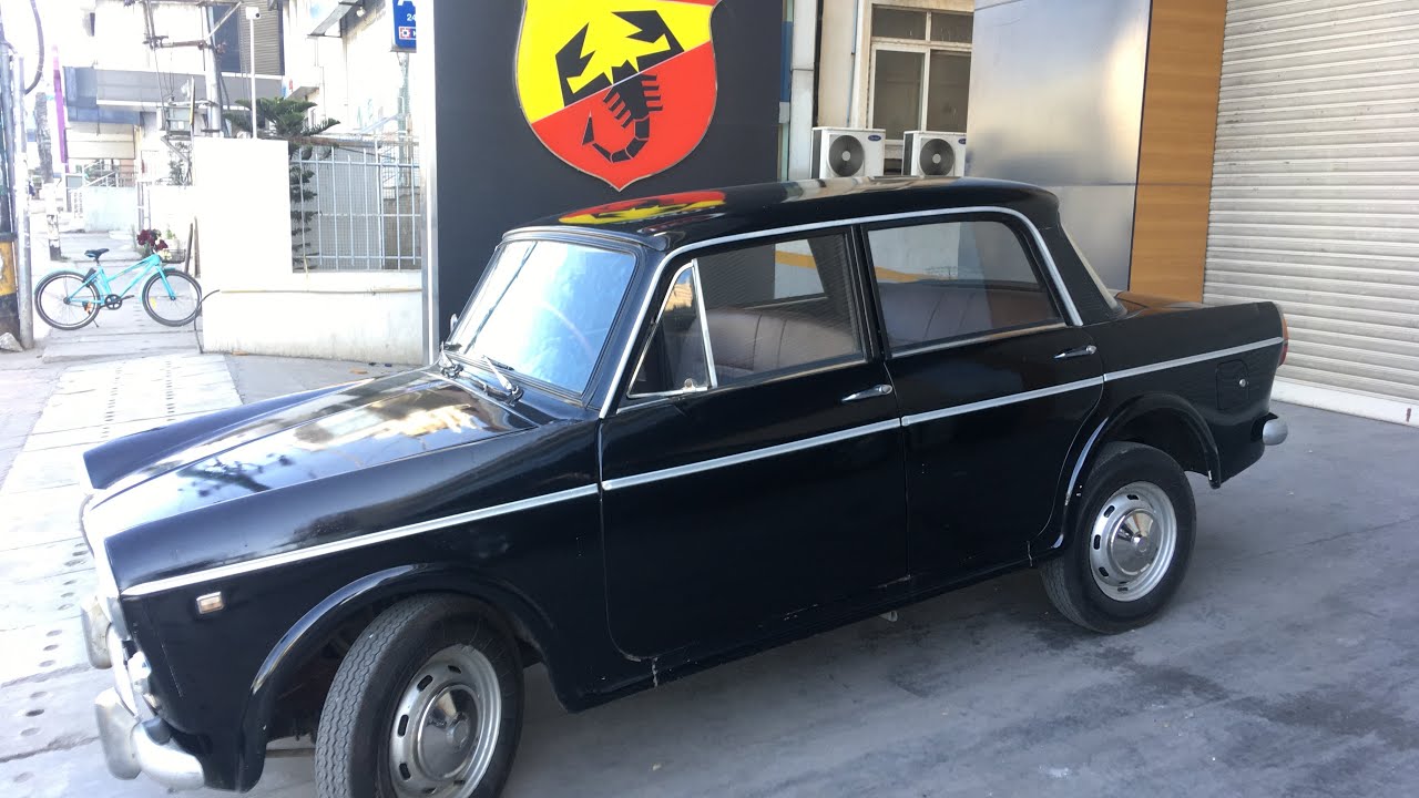 Driving a Fiat 1100D to a FIAT showroom