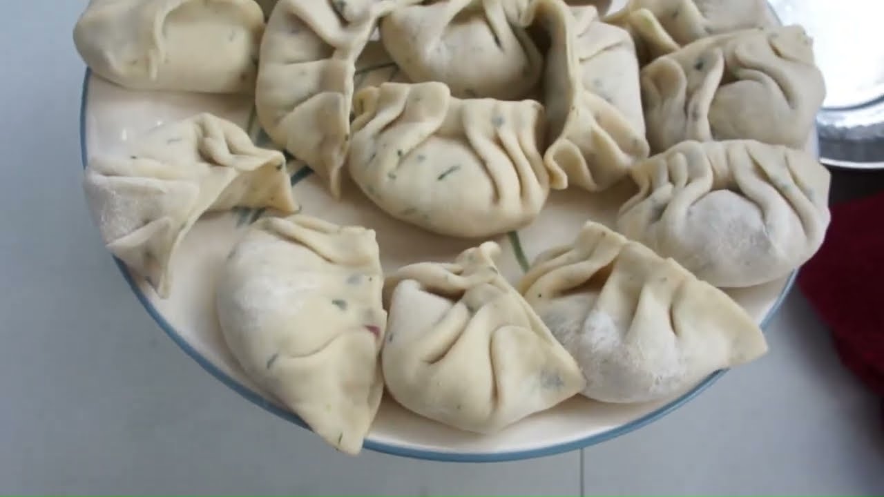 Authentic Indian spiced boiled chicken momos or dumplings in an Instant Pot with wrapping tutorial