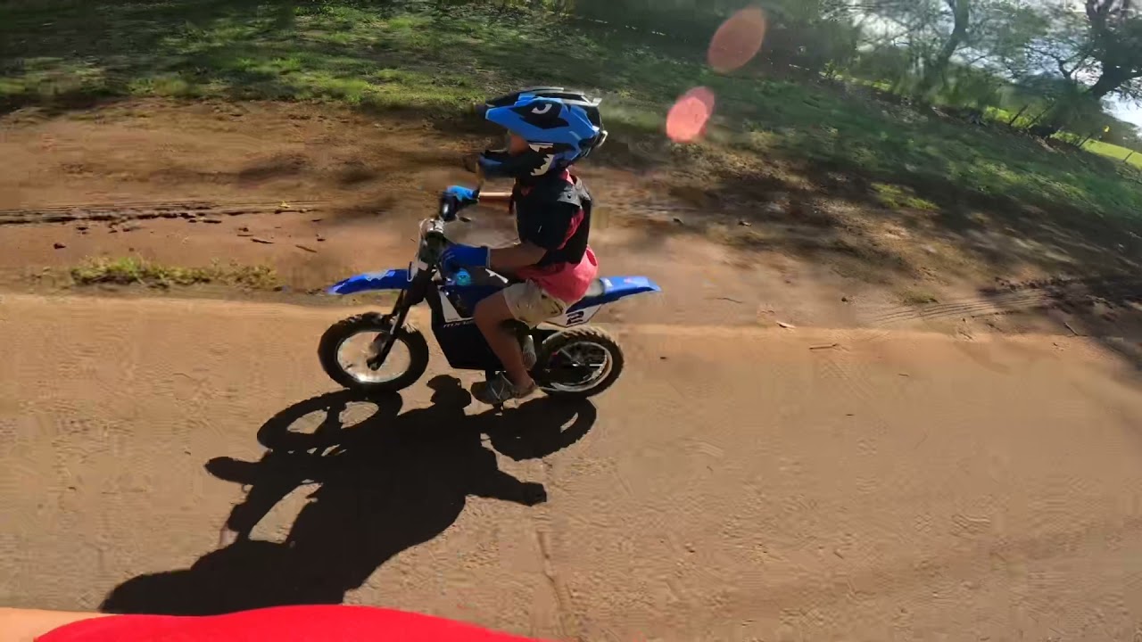 Joshy on his upgraded Razor MX125 riding along Pearl Harbor.