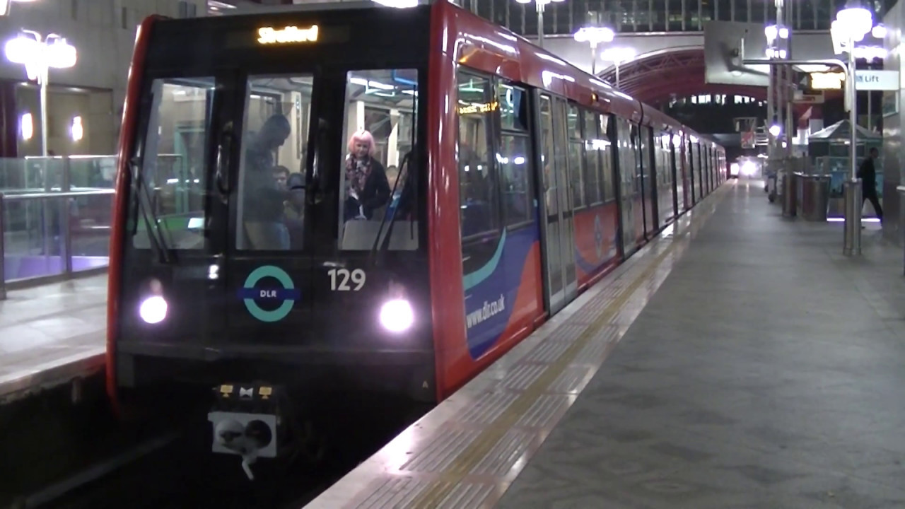 DLR B07 Stock 129, 153 and 134 departing Canary Wharf