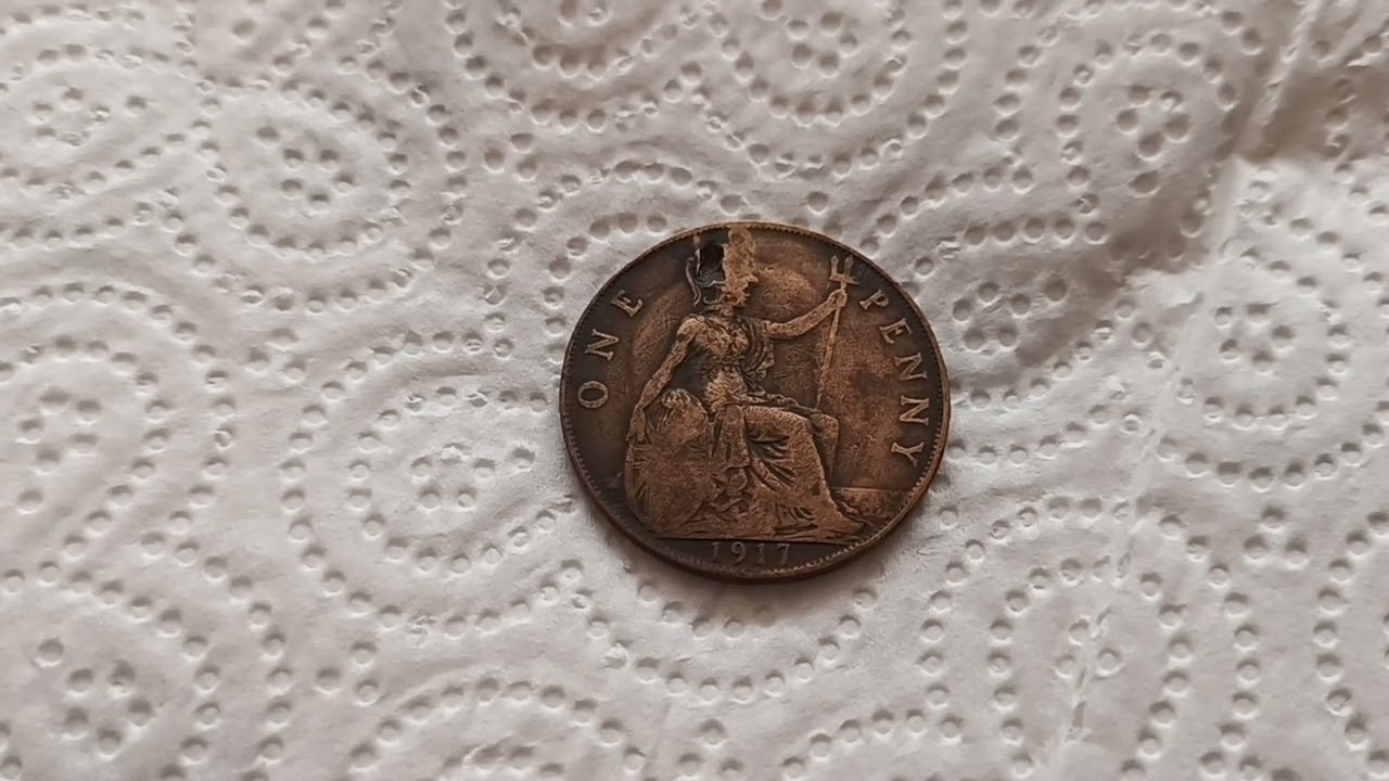 Old coin find. 1917 British penny. World War 1 era. Britannia and King George V
