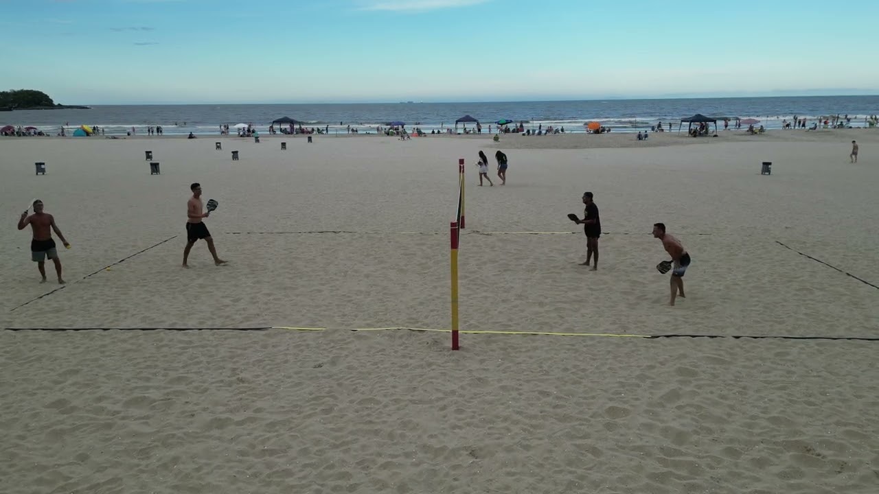 Sandy Pickle is a modified version of pickleball played on grass and sand.