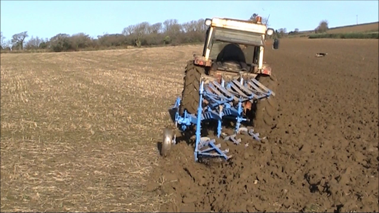 International 674 ploughing