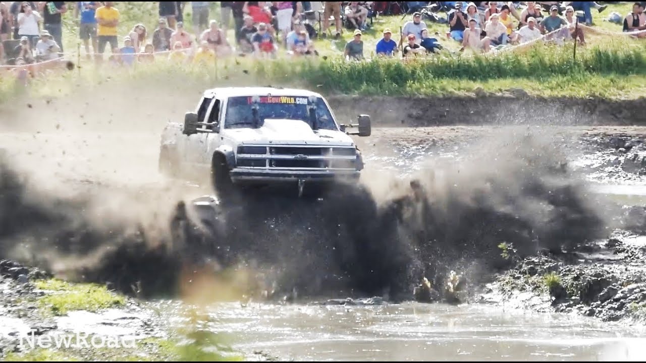 Mud Trucks Bogging in Open Country Mudding