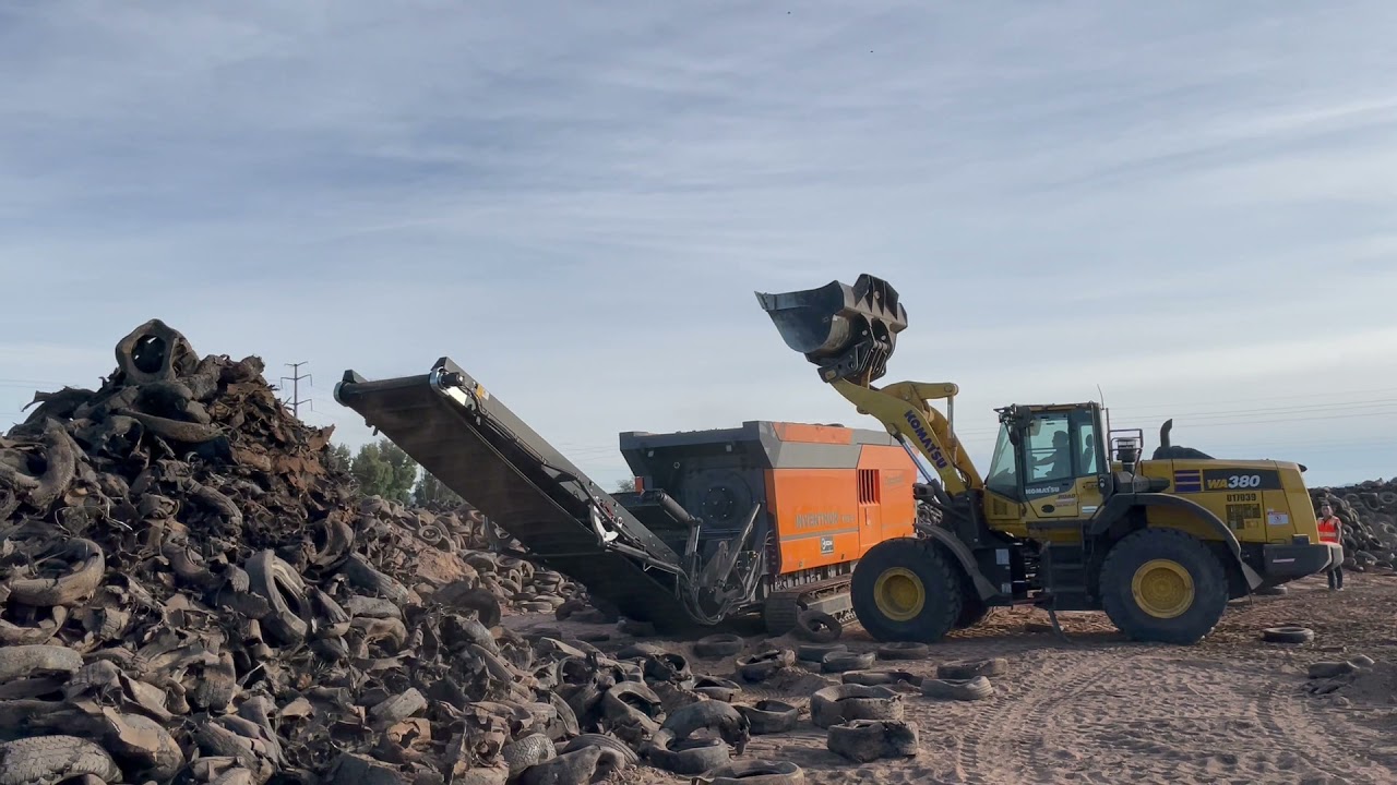 Doppstadt Inventhor Type 9 shredding through a massive pile of tires in AZ