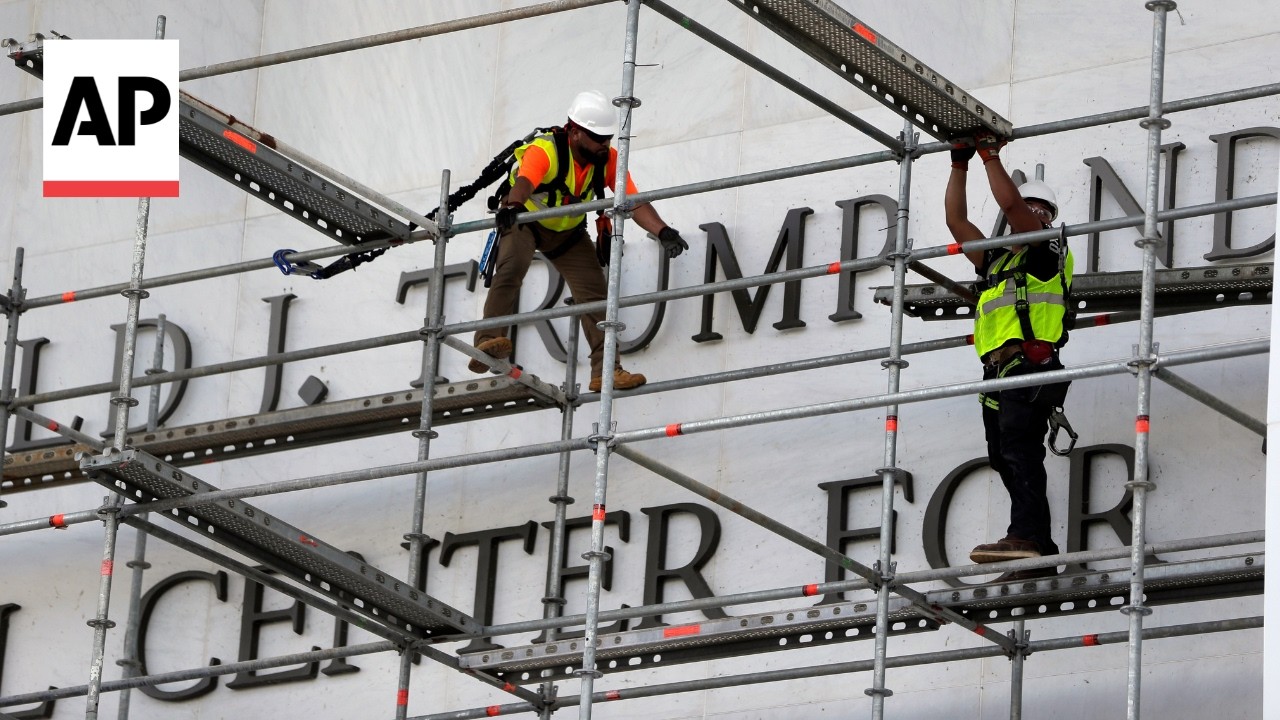 Crews prepare to remove Donald Trump's name from the Kennedy Center