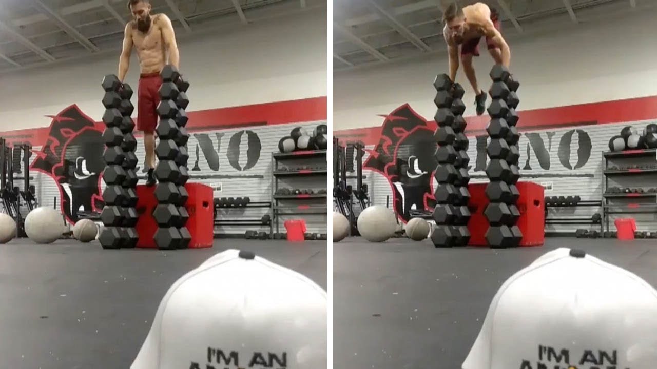 Impressive Stunt Balances On Dumbbells Stack