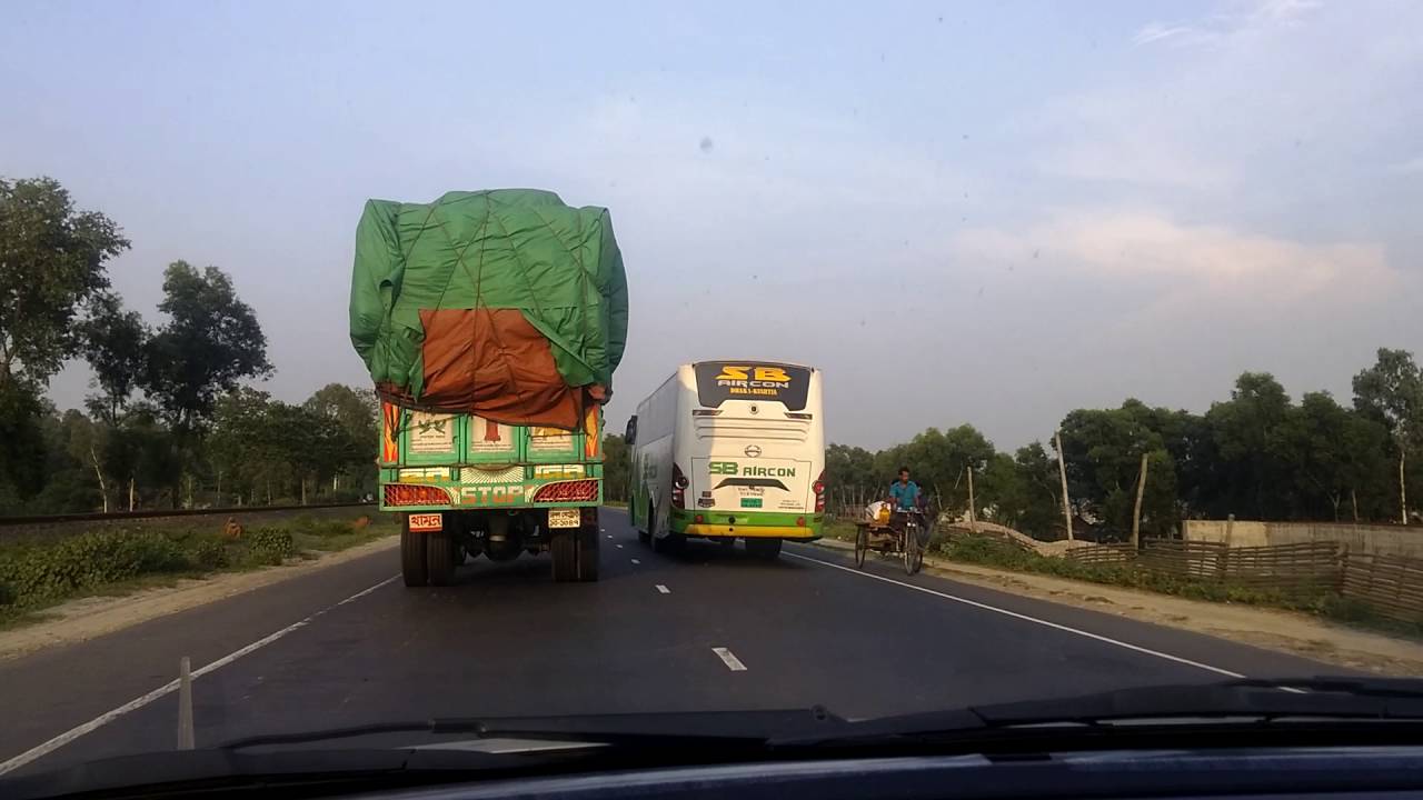 SB super delux overtaking a truck on the jamuna bridge approach road