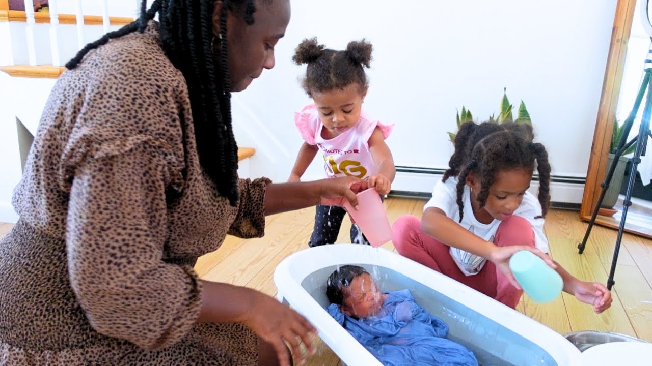 Siblings Help Give Newborn Baby Brother His First Bath