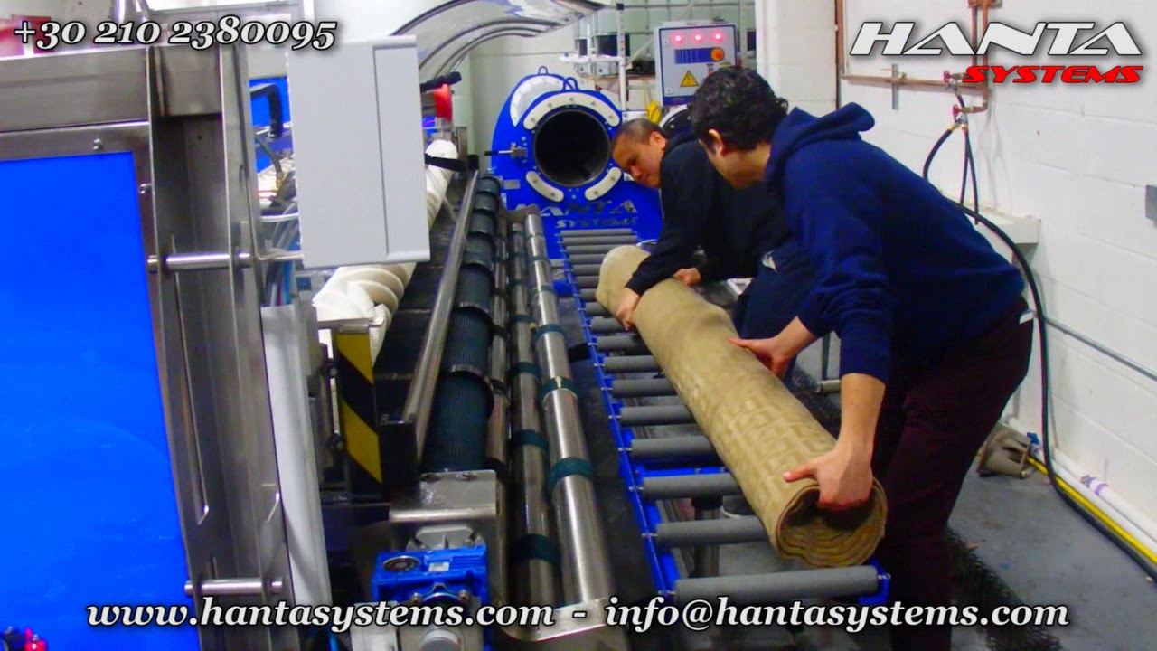 New York installation of an automatic area rug washing machine and one centrifuge