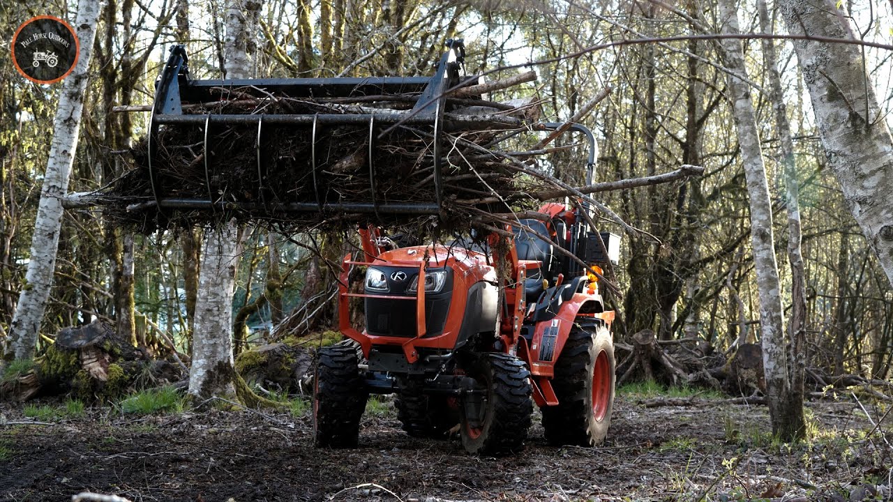 Cutting a trail in the woods. Grapple | Kubota B2601 & Land Pride SGC0660 Grapple