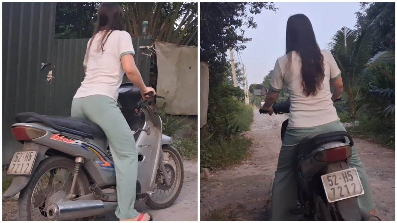 Pretty girl kicks the starter pedal on a Wave motorbike.