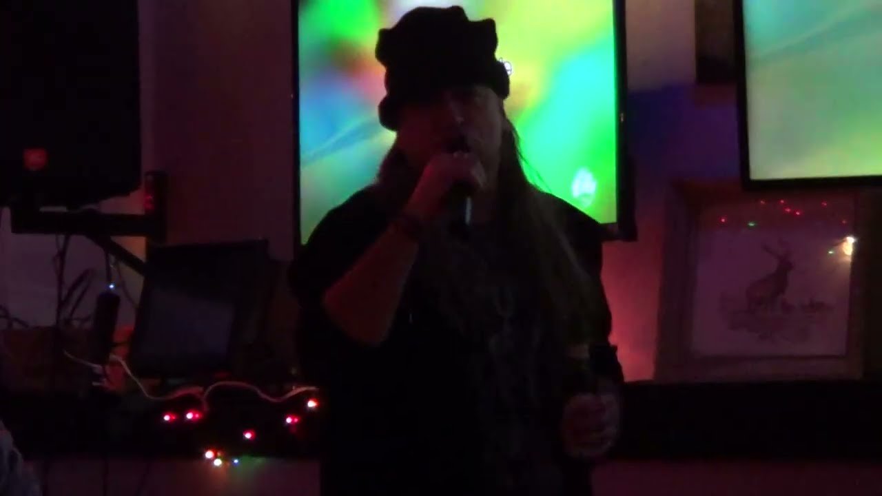Buck Row singing Handle With Care by The Traveling Wilburys at The Elks Lounge on December 26, 2025