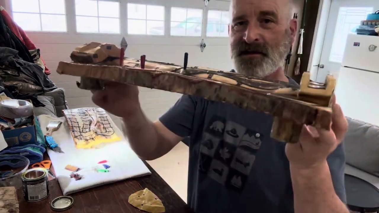 Grampy makes a couple cribbage boards.