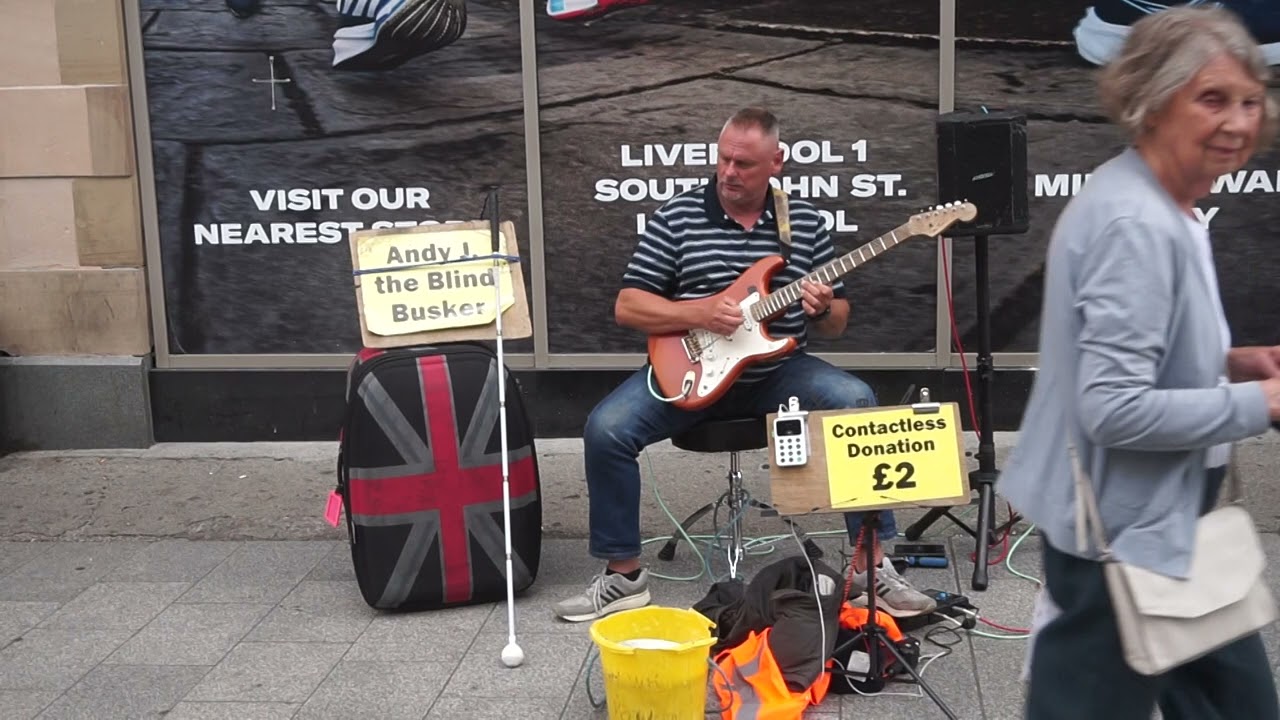 Andy J blind guitarist plays Don't Cry For Me Argentina in Church Street Liverpool