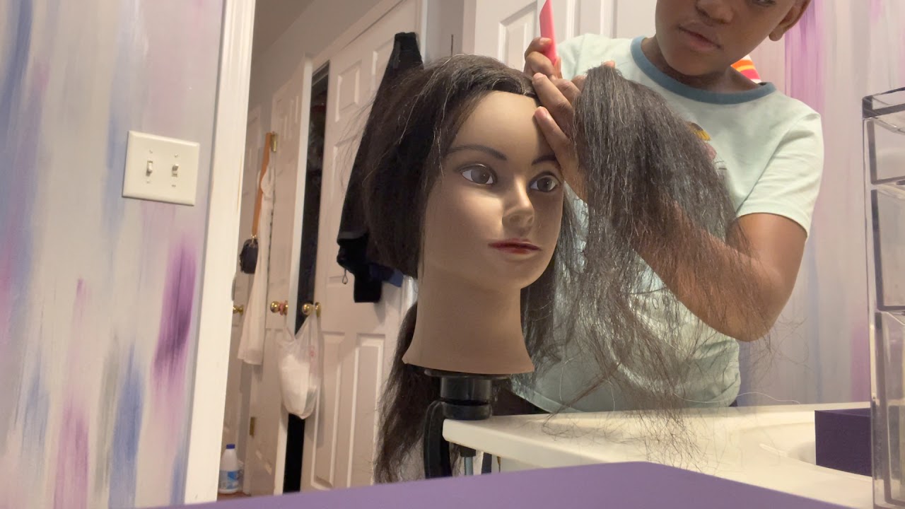 Doing my Mannequins hair￼