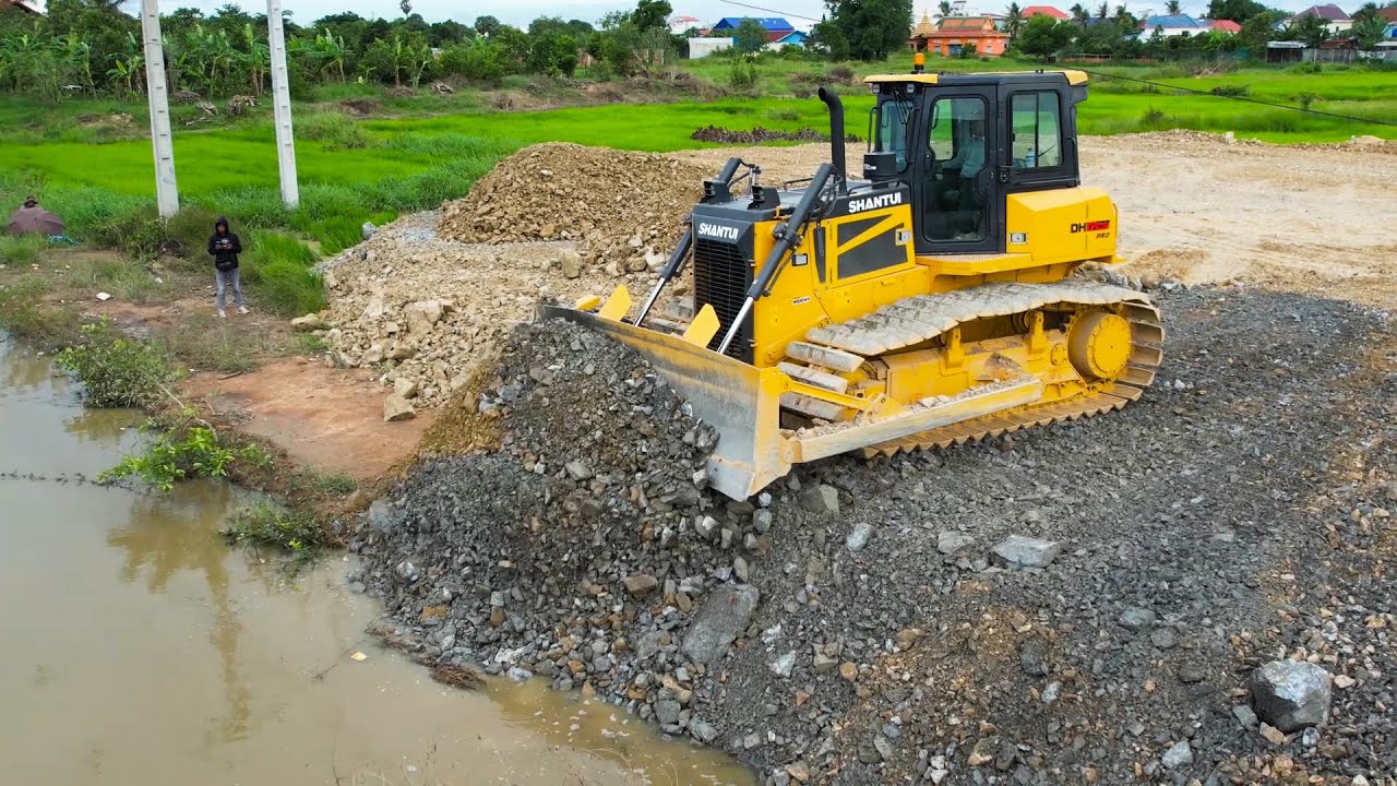 Skill with Power Machinery Bulldozer Moving Dirt Dump Truck Unloading Dirt On Construction