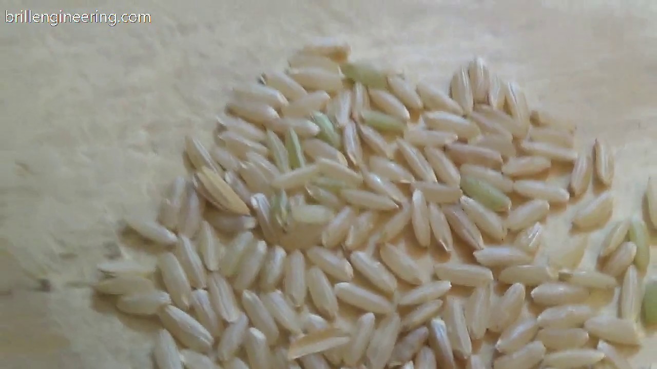 de-hulling rice between wood pieces brillengineering.com