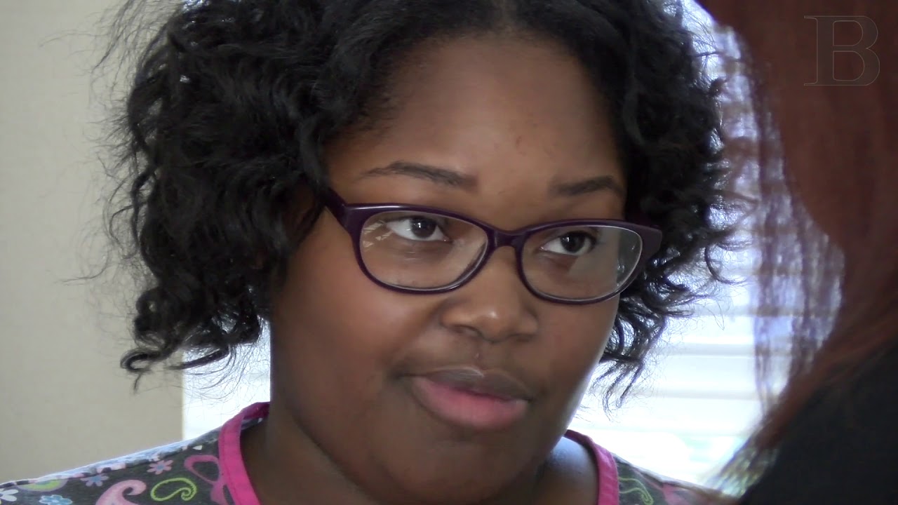 Single mother earns new home