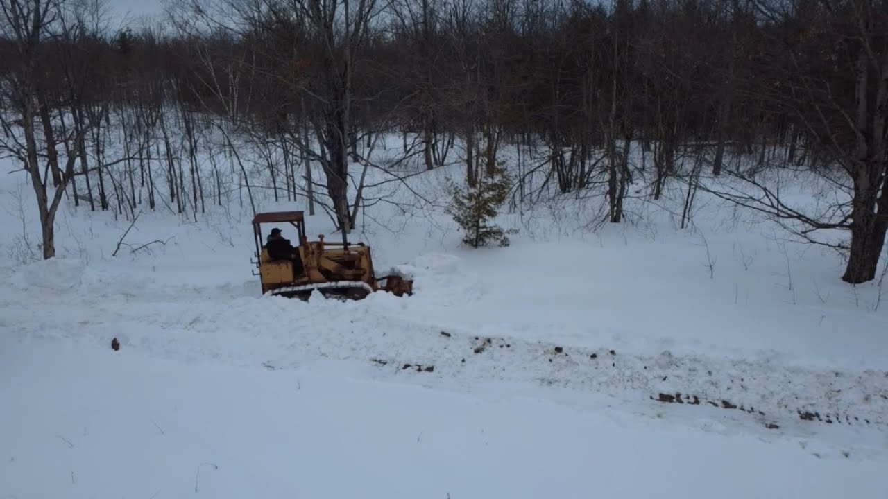 Old crawler plowing deep snow!