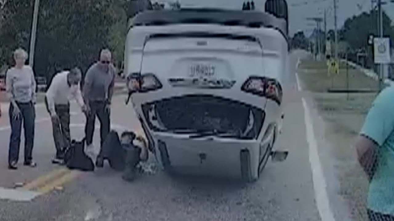 Officer Rescues Teenage Sisters Trapped In Overturned SUV