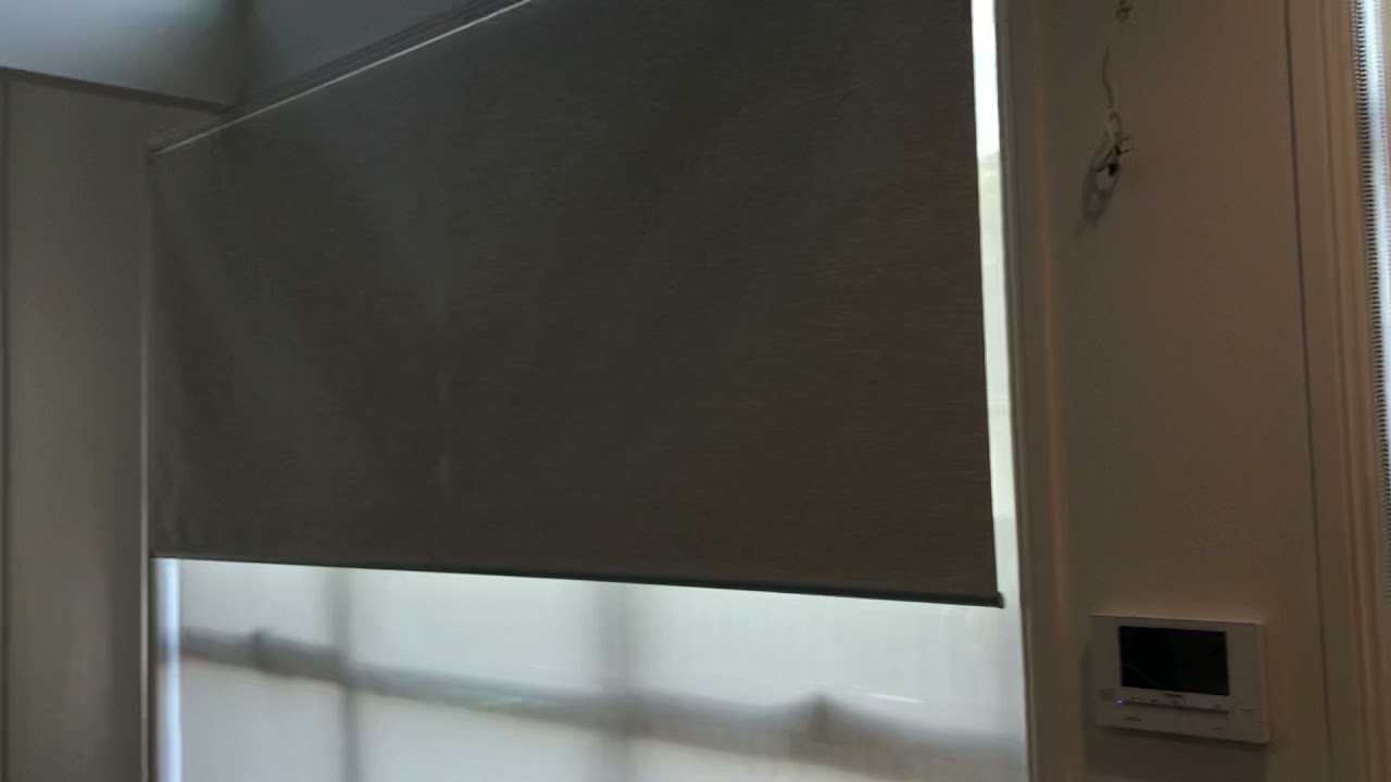 One way vision blind with motorised blockout roller blind