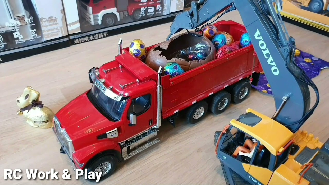 RC Volvo EC160E 3-in-1 excavator demolishing big Cadbury chocolate Easter egg!