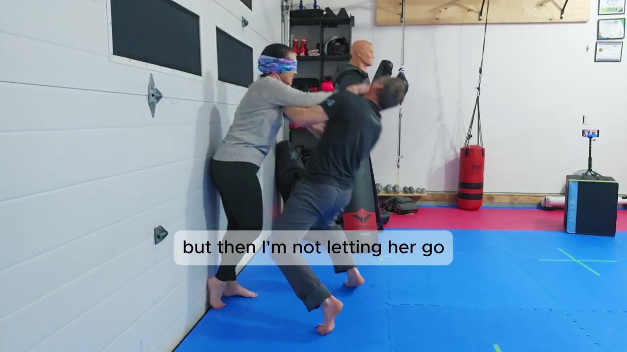 How to defend a choke when against a wall
