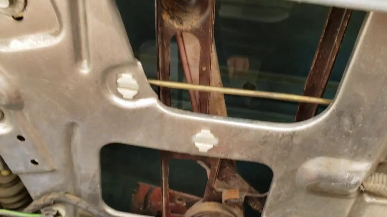 Remove inner door panel and disconnect handle and locks on a C4 Corvette