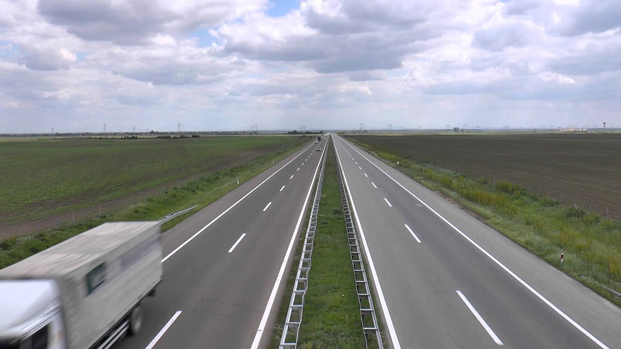 Mouvee - free stock footage - looking at traffic on highway from overpass