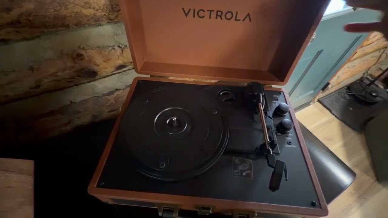 The Catch Cabin Lake Harmony- playing a record on the record player 