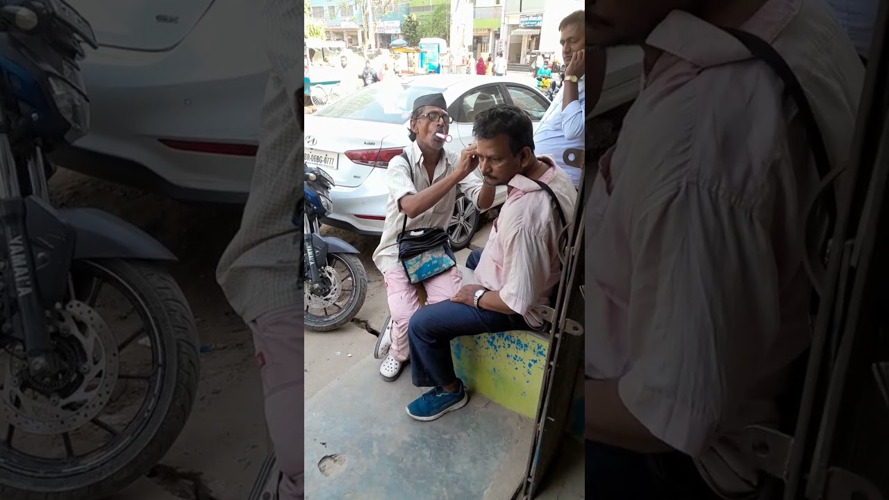 ear cleaning in Road side ..