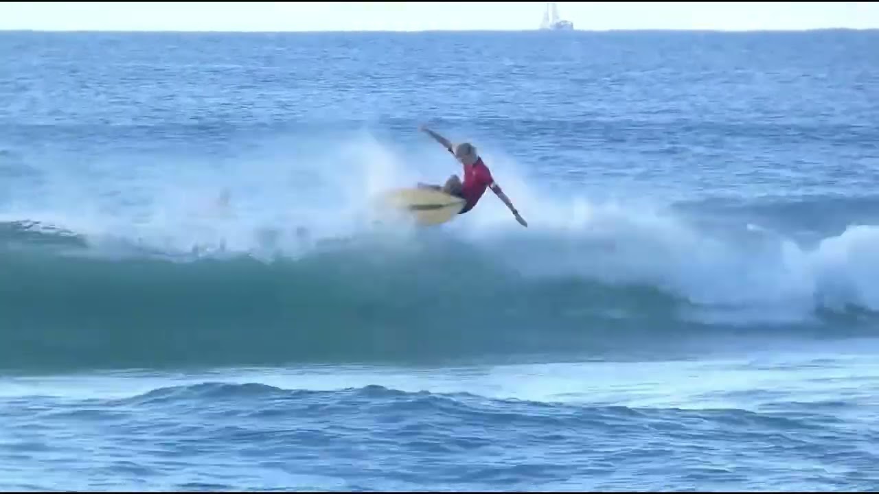 Sunny Tomkins surfing