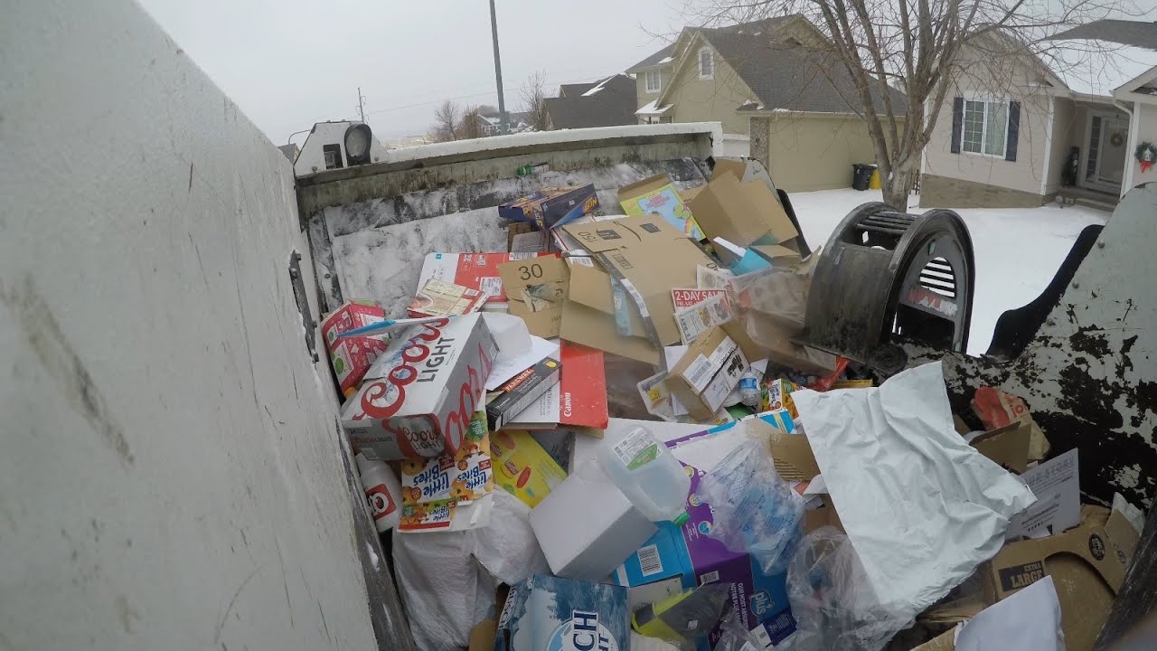 CNG Garbage Truck in Snow, Hopper and Arm View. 2017 McNeilus ZeroRadius ASL
