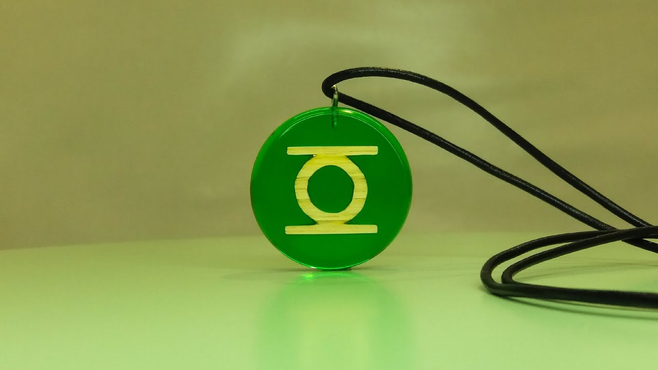 Resin art jewelry. Green lantern pendant made of wood and epoxy resin.Diy /Epoxy resin/